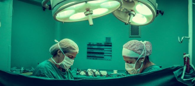 two-person-doing-surgery-inside-room-1250655